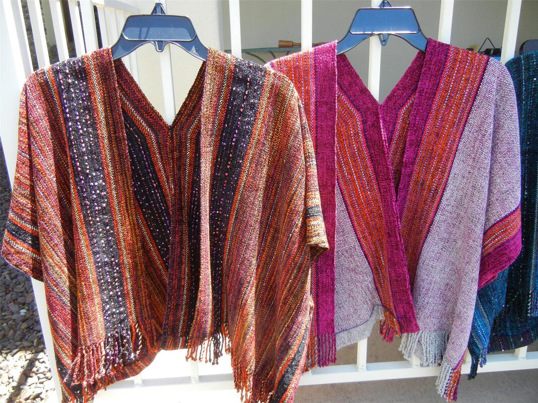 Two brightly-colored handwoven ruanas