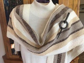Handwoven scarf with shawl pin