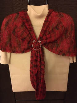 Deep red handknit shawlette with horseshoe pin
