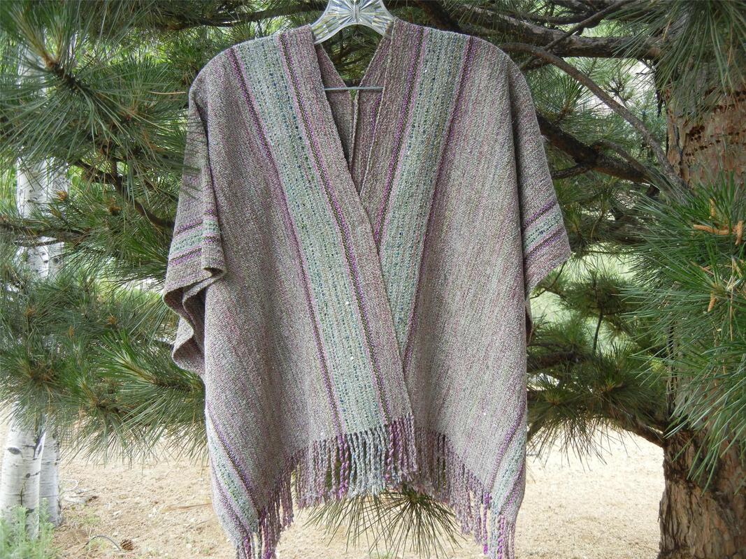 Handwoven ruana in muted purples and blues