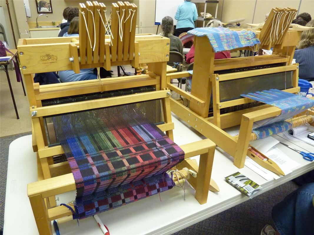 Two table looms with weaving